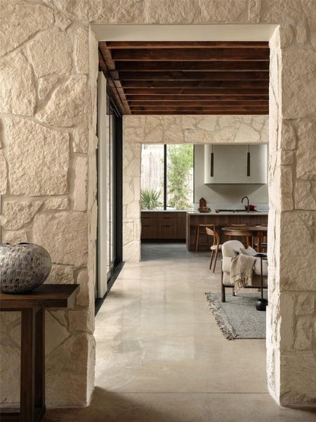 Exquisite foyer looking into the living, dining and kitchen area.