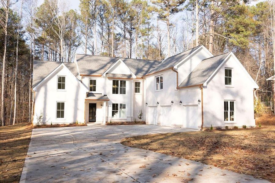 Front exterior of a new home in , Atlanta, GA, highlighting curb appeal (Image 1).