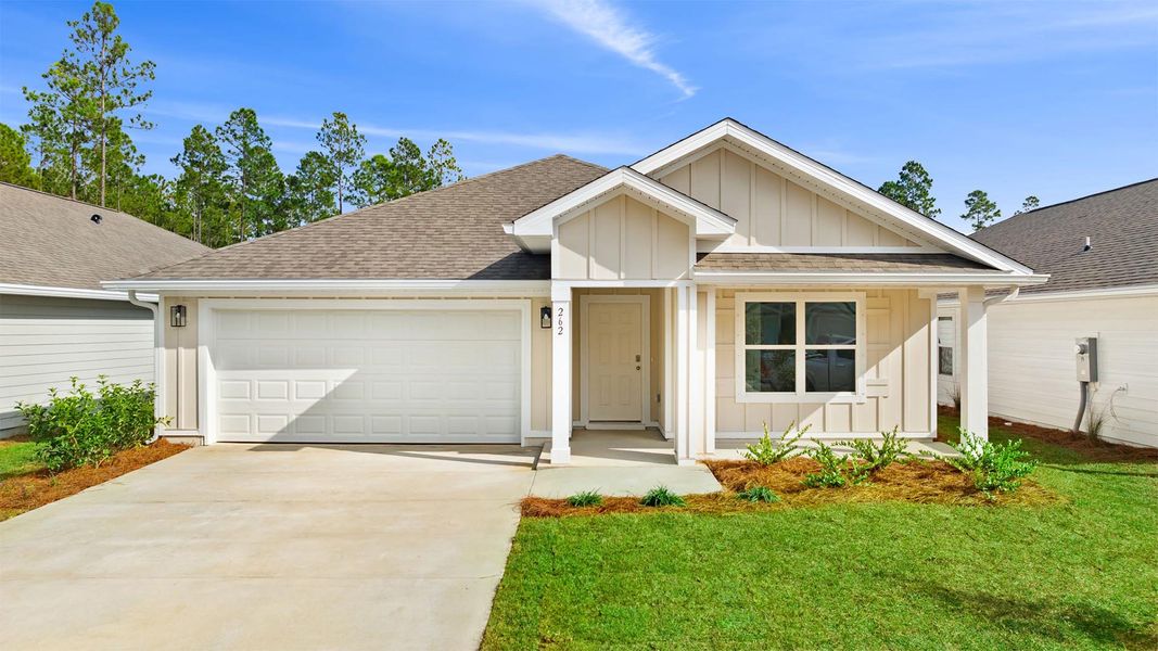 Front exterior of a new home in Ashton Park Phase III, Freeport, FL, highlighting curb appeal (Image 1).