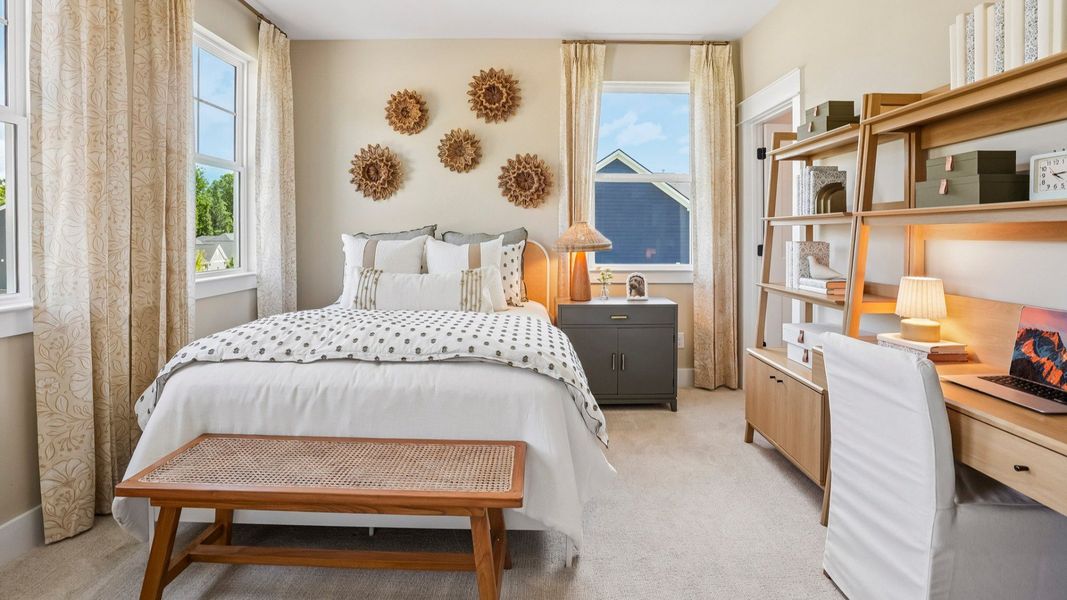Secondary bedroom with carpet and windows Secondary bedroom with carpet and windows