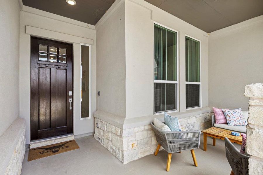 Property entrance with stone siding