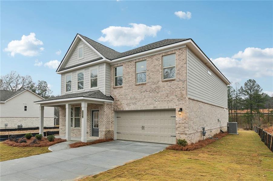 Front exterior of a new home in Hamilton Lakes, Lawrenceville, GA, highlighting curb appeal (Image 1). Front exterior of a new home in Hamilton Lakes, Lawrenceville, GA, highlighting curb appeal (Image 1).
