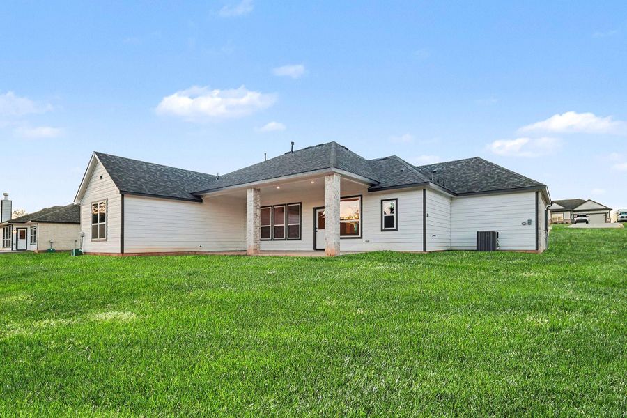 Exterior details and patio area of a home in Rose Hill Estates, Willis (Image 26).