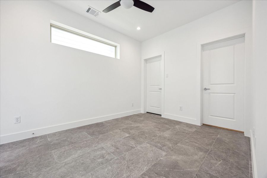 Bedroom on the First Floor * Porcelain Tile Floors. Bedroom on the First Floor * Porcelain Tile Floors.