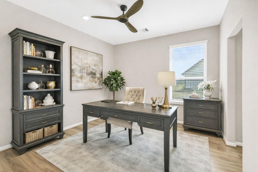 Virtually staged office is  bright and airy with multiple uses