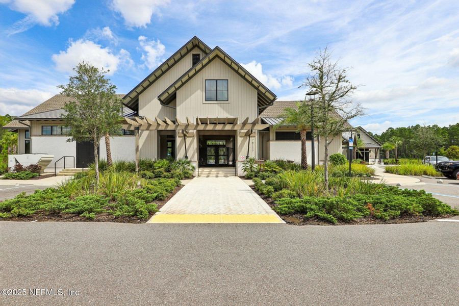 Front exterior of a new home in Tributary, Yulee, FL, highlighting curb appeal (Image 19). Front exterior of a new home in Tributary, Yulee, FL, highlighting curb appeal (Image 19).