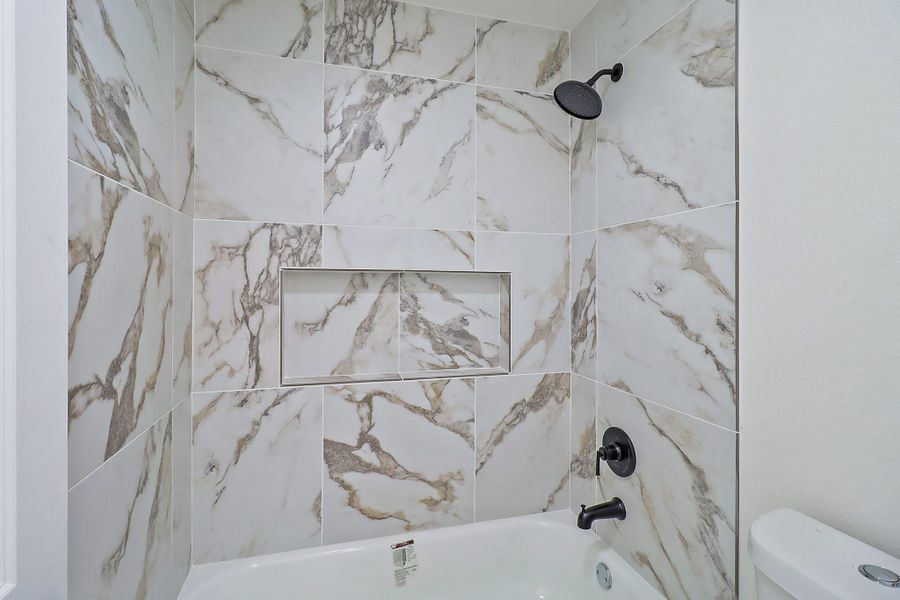 The tile work in the secondary bedroom is also fabulous.