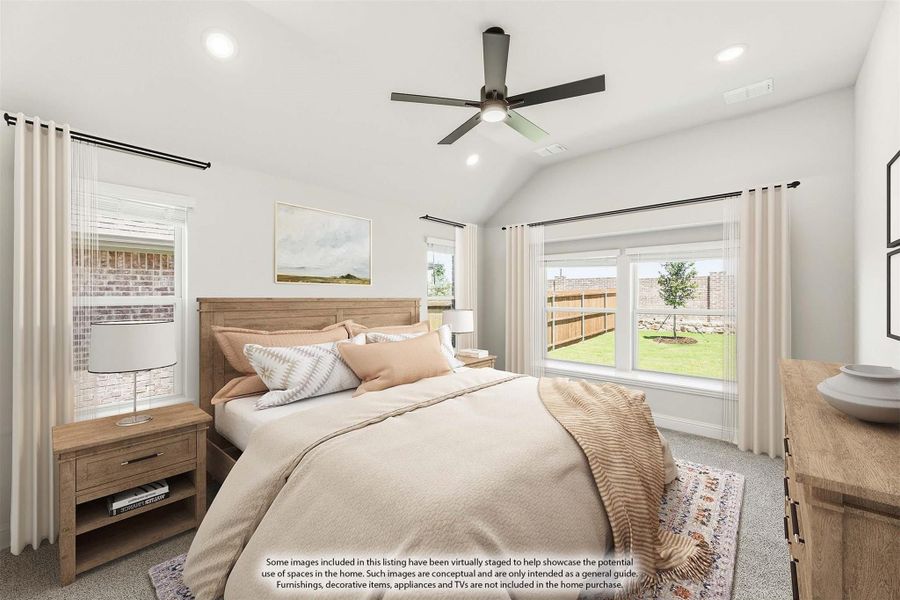 Bedroom with vaulted ceiling, ceiling fan, wood furniture, and large windows overlooking backyard