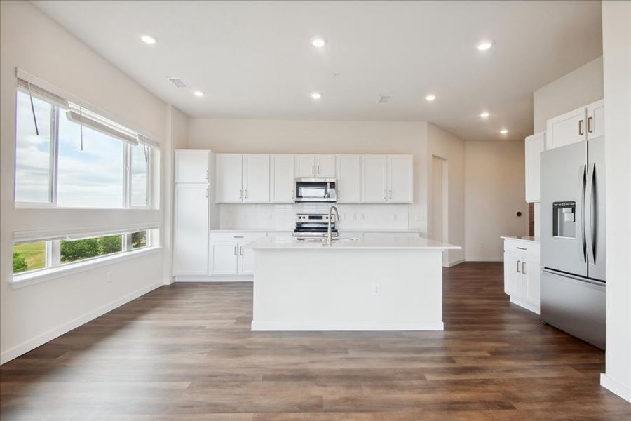 A kitchen with white cabinets. A kitchen with white cabinets.