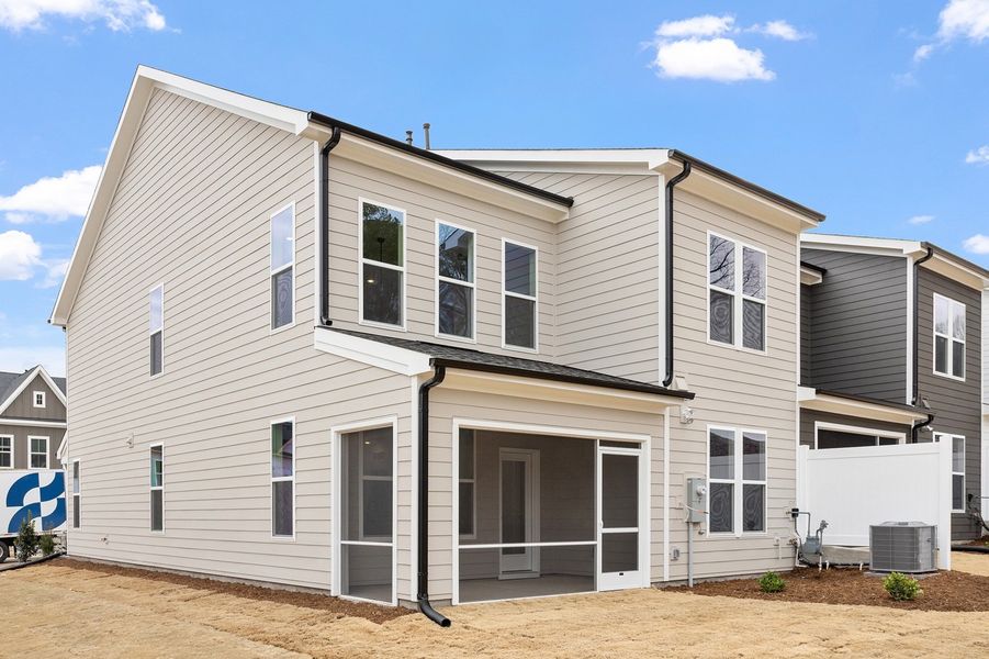 Exterior details and patio area of a home in Ovation at Sweetbrier, Durham (Image 21). Exterior details and patio area of a home in Ovation at Sweetbrier, Durham (Image 21).