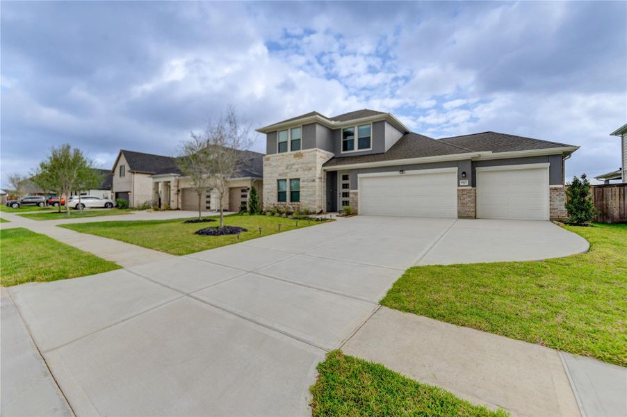 Front exterior of a new home in Arabella on the Prairie, Richmond, TX, highlighting curb appeal (Image 25).