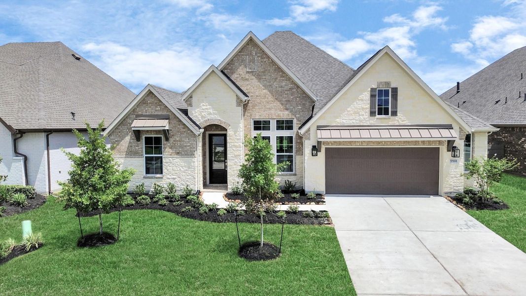 Front exterior of a new home in ARTAVIA: Hilltop Collection, Conroe, TX, highlighting curb appeal (Image 25). Front exterior of a new home in ARTAVIA: Hilltop Collection, Conroe, TX, highlighting curb appeal (Image 25).