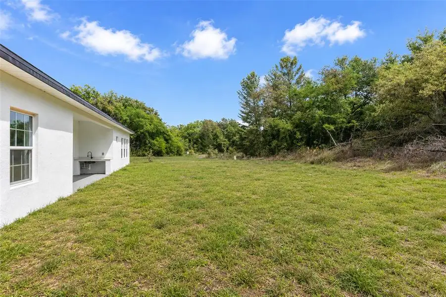 Exterior details and patio area of a home in , Ocala (Image 3).