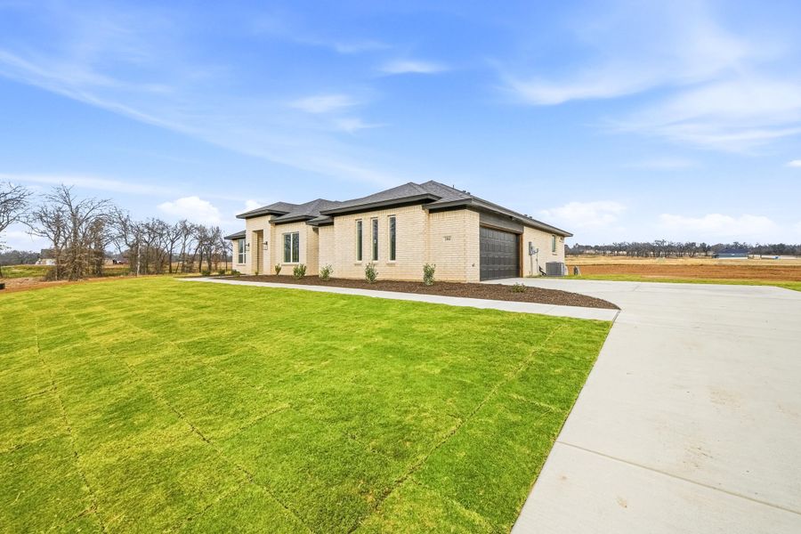 Front exterior of a new home in Taylor Ranch, Springtown, TX, highlighting curb appeal (Image 22).