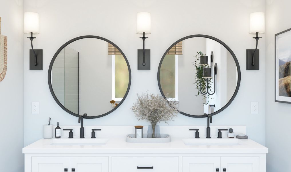 Two black-framed circular mirrors in the primary bath