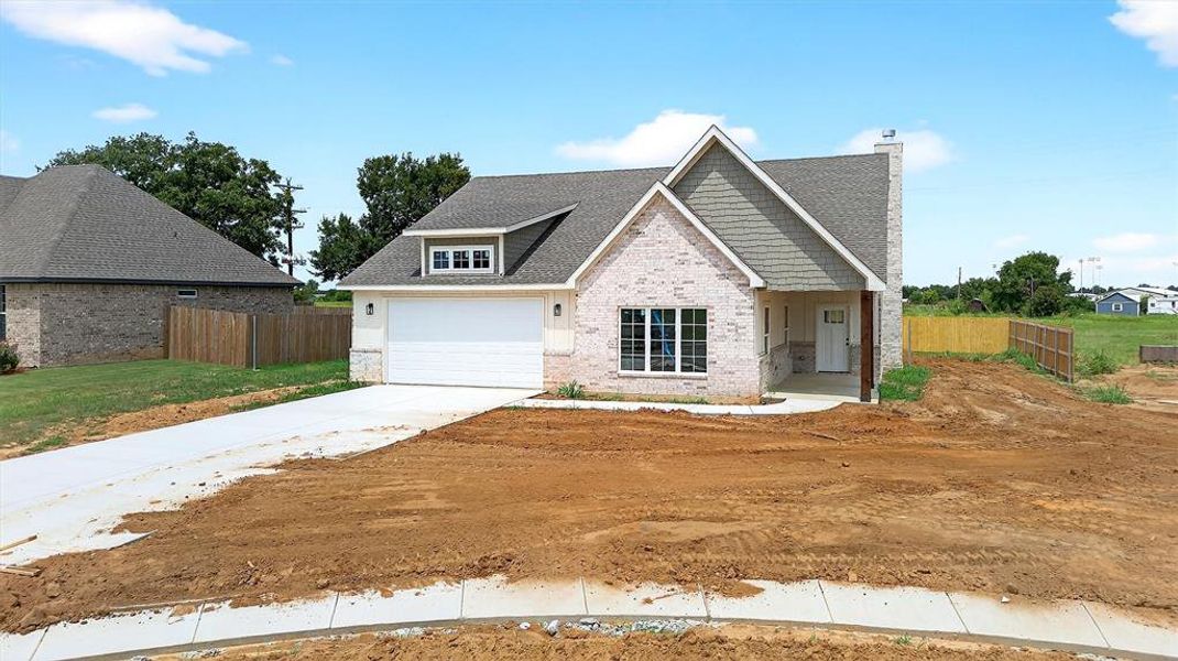 Front exterior of a new home in , Callisburg, TX, highlighting curb appeal (Image 21).