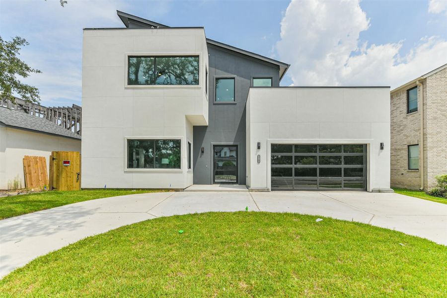 Front exterior of a new home in , Houston, TX, highlighting curb appeal (Image 1).