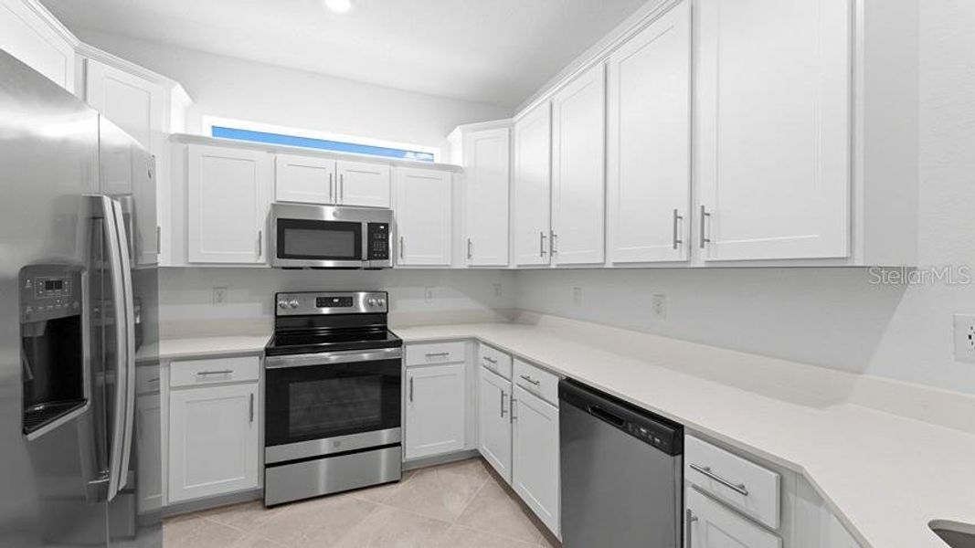Furnished interior view inside a new home in Palm Lake at Coco Bay, Englewood (Image 4).