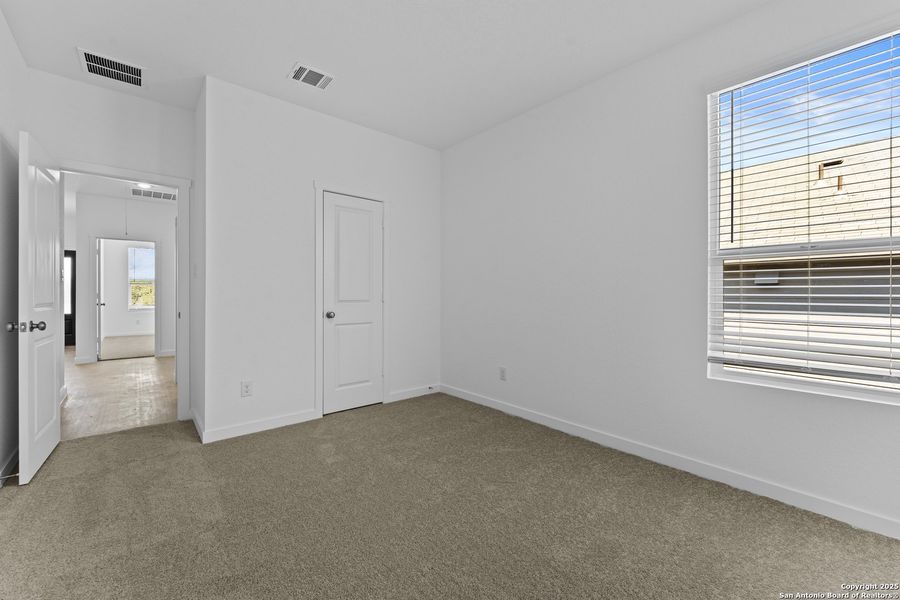 Spacious, unfurnished interior of a new home in Waterwheel: Coastline Collection, San Antonio (Image 14).