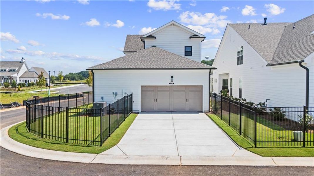 Front exterior of a new home in Promenade at Sawnee Village, Cumming, GA, highlighting curb appeal (Image 25).