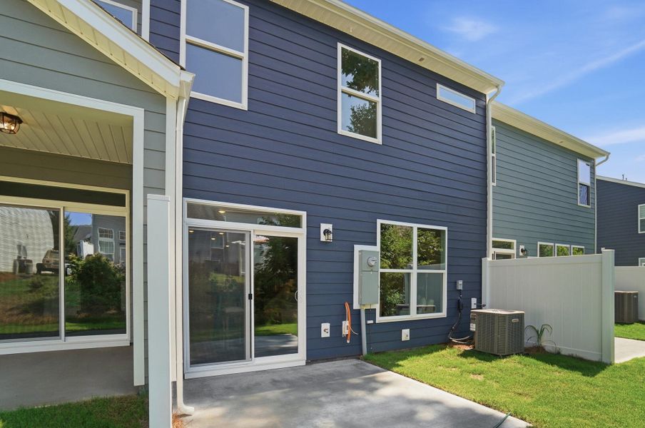 Exterior details and patio area of a home in Harrisburg Village Townhomes, Harrisburg (Image 3).