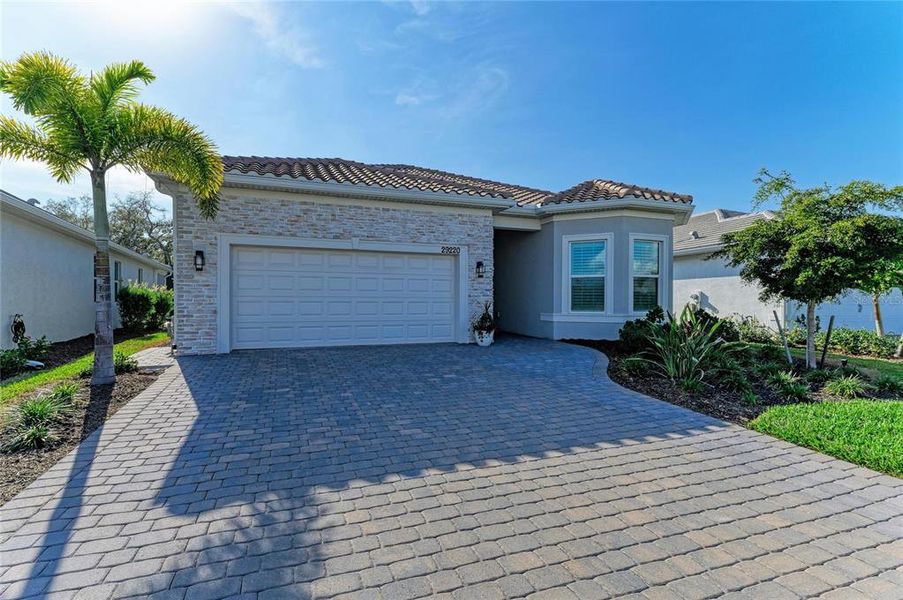 Front exterior of a new home in , Englewood, FL, highlighting curb appeal (Image 2). Front exterior of a new home in , Englewood, FL, highlighting curb appeal (Image 2).