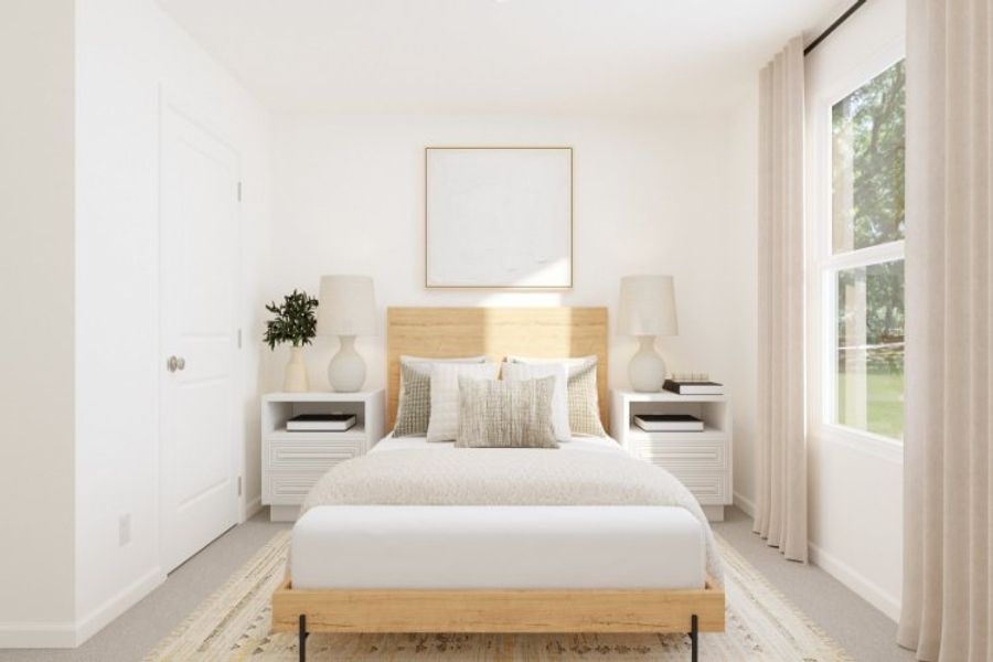 A white bed in a room.