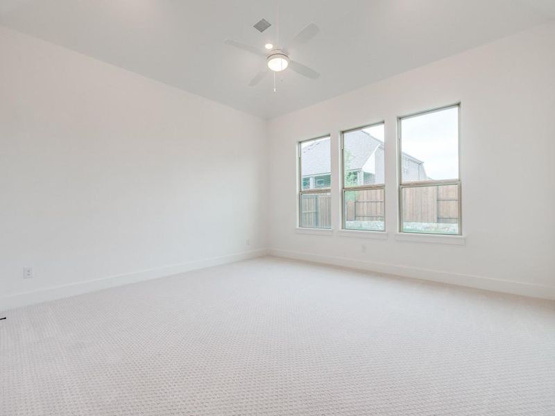 Your dreamy owner's suite is located at the rear of the home for additional privacy.