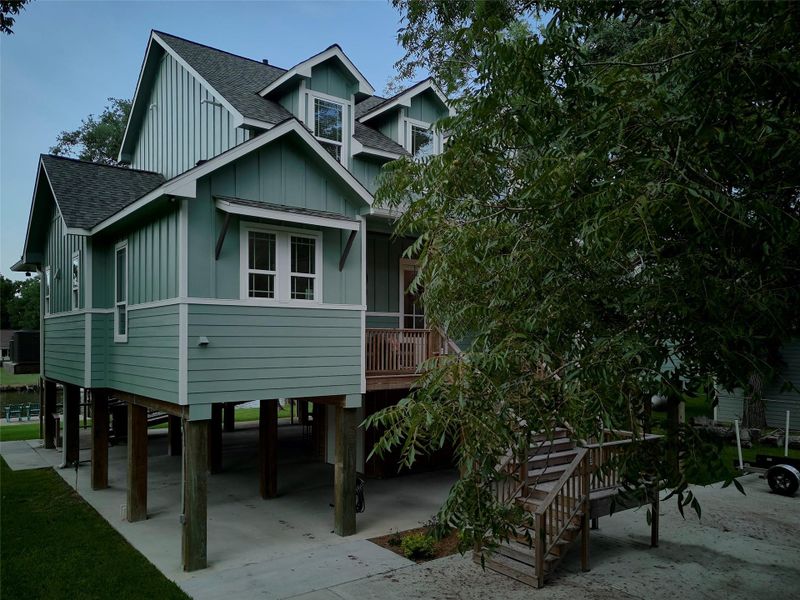 Front exterior of a new home in , Sargent, TX, highlighting curb appeal (Image 19). Front exterior of a new home in , Sargent, TX, highlighting curb appeal (Image 19).