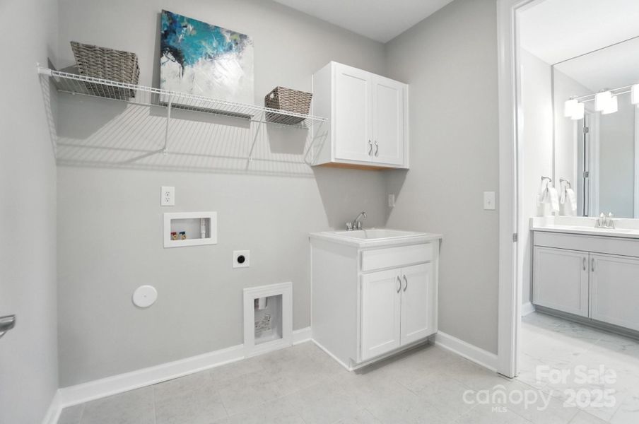 Laundry with doors to hall and Primary Bath Laundry with doors to hall and Primary Bath