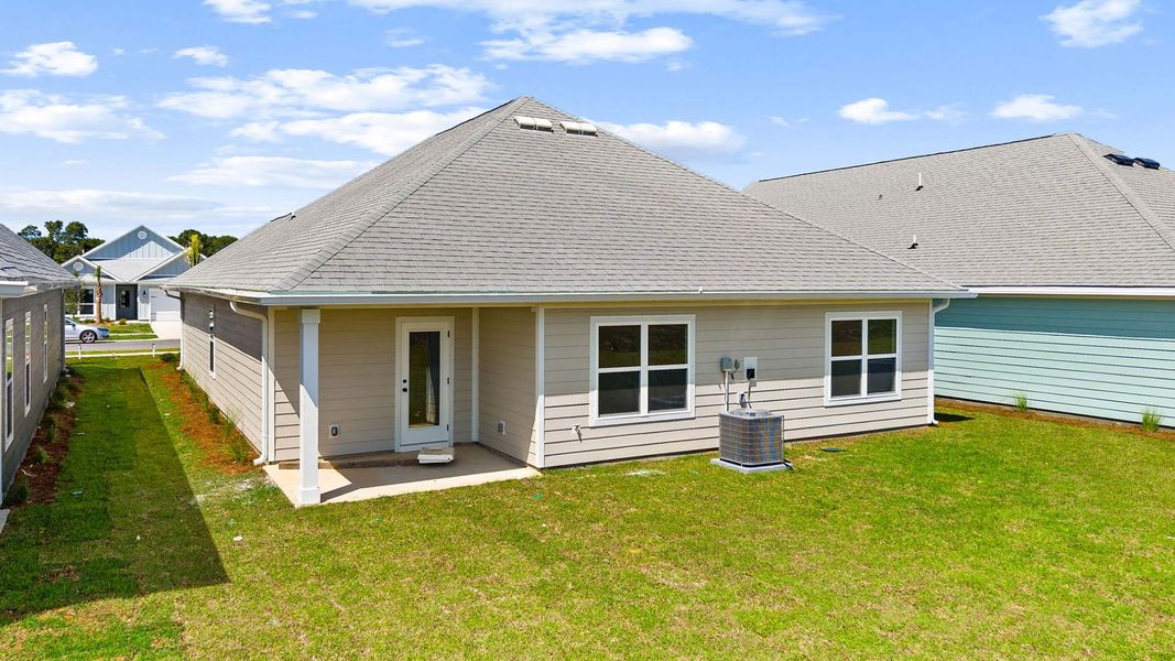 Exterior details and patio area of a home in Caballeros Estates At Hombre, Panama City Beach (Image 4).