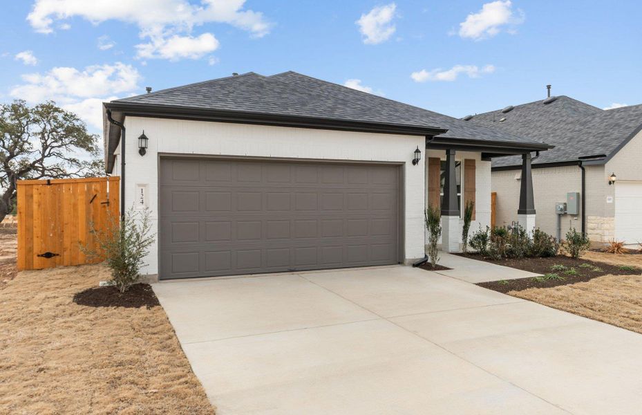 Front exterior of a new home in Woodside, Georgetown, TX, highlighting curb appeal (Image 19).