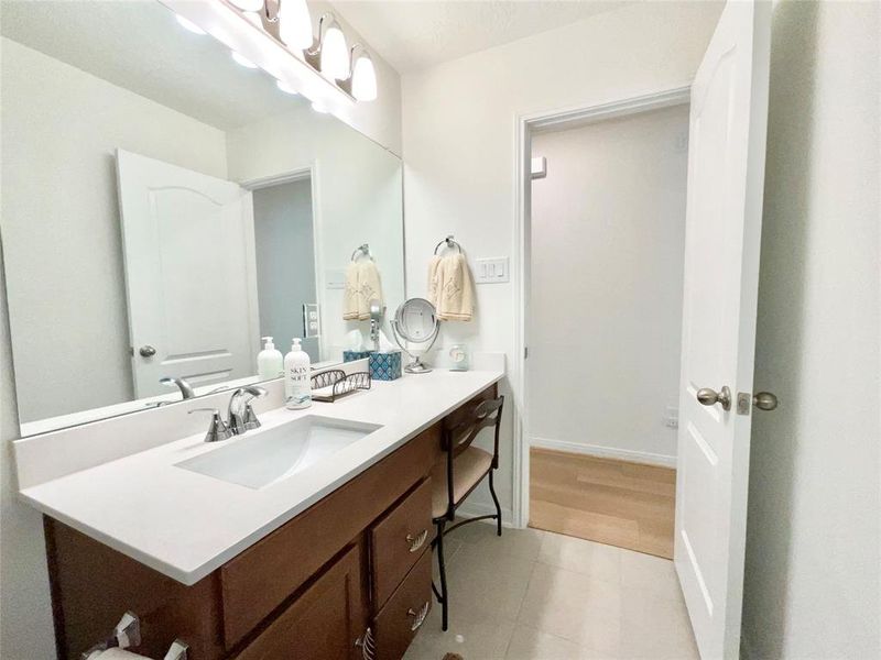 Large sink and counter space comes with a powder area and seating space.