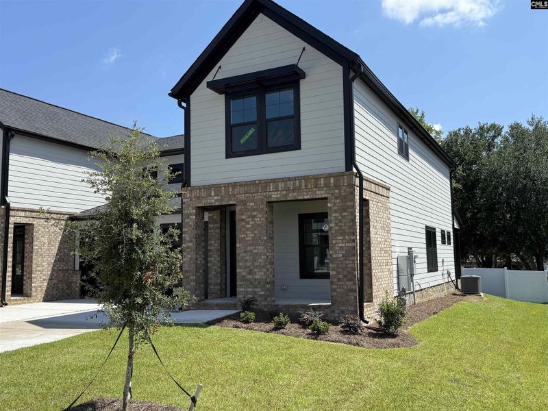 Front exterior of a new home in Dunbar Village, Cayce, SC, highlighting curb appeal (Image 24). Front exterior of a new home in Dunbar Village, Cayce, SC, highlighting curb appeal (Image 24).