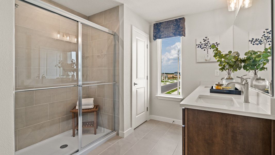Primary Suite en suite Bathroom in the Model Highbourne by DRB Homes in Hamilton Bluff located in Haines City, FL. Primary Suite en suite Bathroom in the Model Highbourne by DRB Homes in Hamilton Bluff located in Haines City, FL.