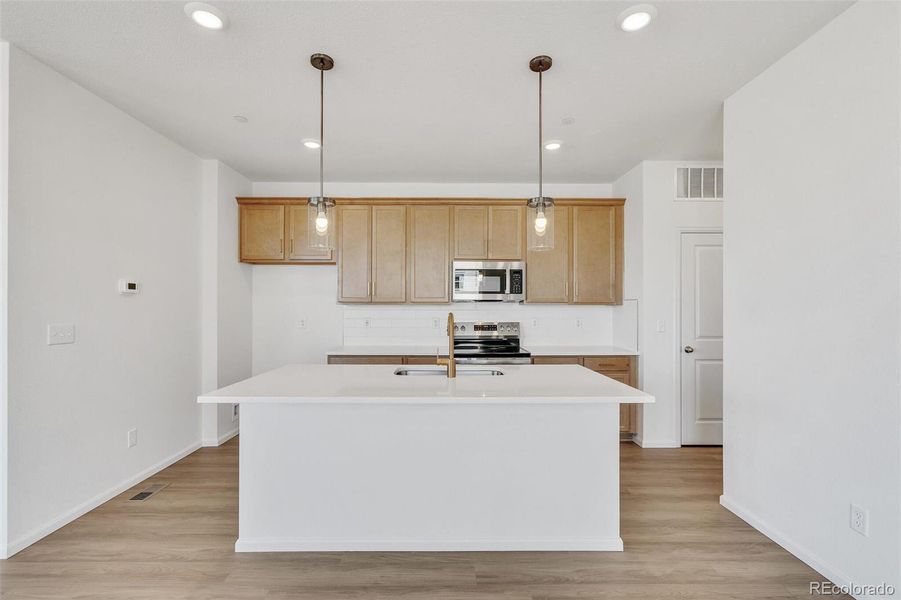 Furnished interior view inside a new home in Turnberry, Commerce City (Image 14).