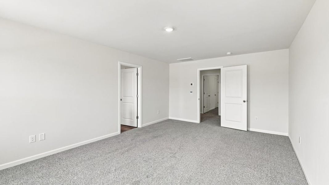 Spacious, unfurnished interior of a new home in Bentley Park, Greenwood (Image 33).