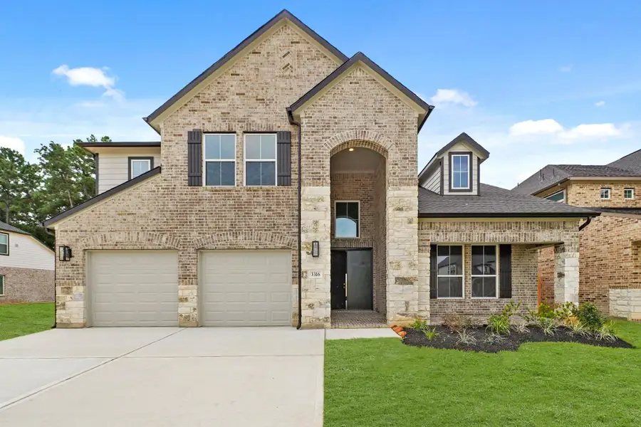 Front exterior of a new home in Barton Creek Ranch, Conroe, TX, highlighting curb appeal (Image 11). Front exterior of a new home in Barton Creek Ranch, Conroe, TX, highlighting curb appeal (Image 11).