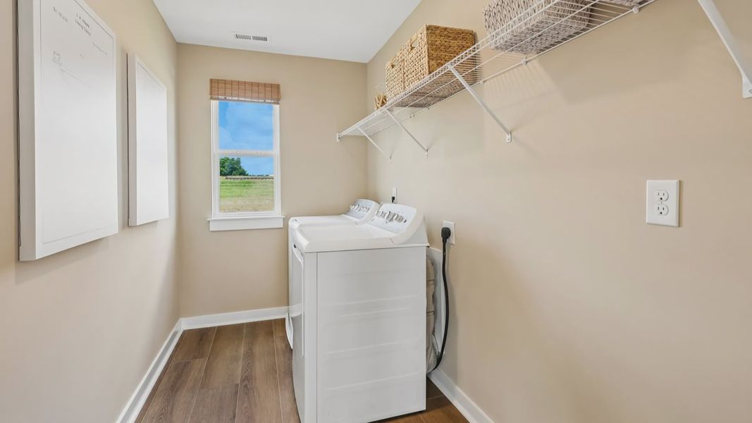 Dedicated laundry space with window and ventilated shelf