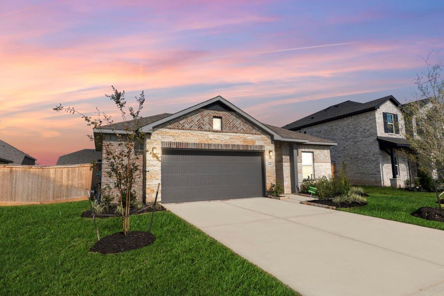 Welcome home to this beautiful brick-and-stone ranch-style exterior! The inviting curb appeal showcases a neatly landscaped yard, full sod, and a spacious driveway leading to your 2½-car garage. Imagine relaxing evenings watching the sunset right from your front porch—such a warm Texas welcome!