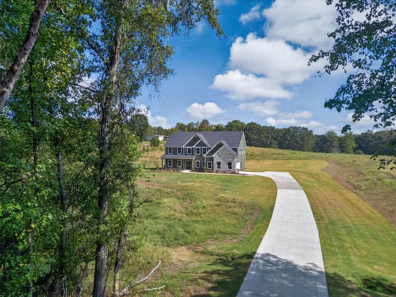 Front exterior of a new home in Blackwelder Bluff, Bowdon, GA, highlighting curb appeal (Image 27).