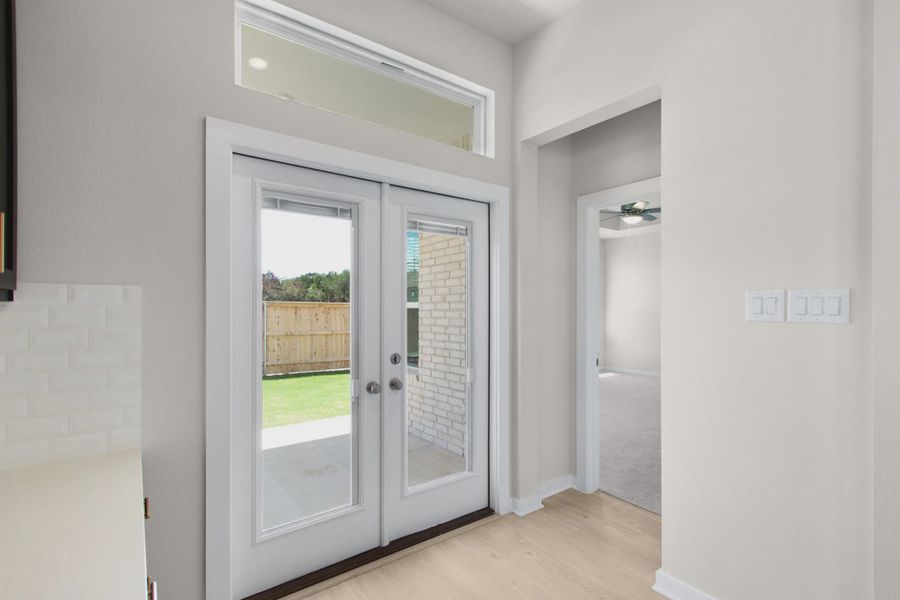 Representative unfurnished interior of a home built from the Warner by Chesmar Homes in The Grove at Blackhawk, Pflugerville (Image 8).