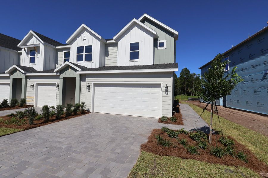 Front exterior of a new home in Preserve at The Cays – The Harbor Series, Daytona Beach, FL, highlighting curb appeal (Image 12).
