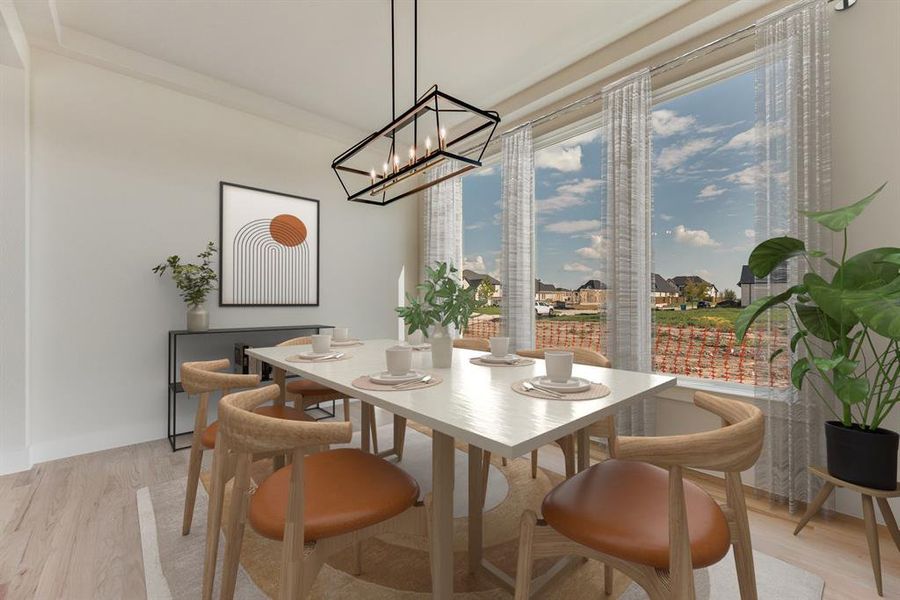 Dining room featuring light wood-style floors and baseboards Dining room featuring light wood-style floors and baseboards