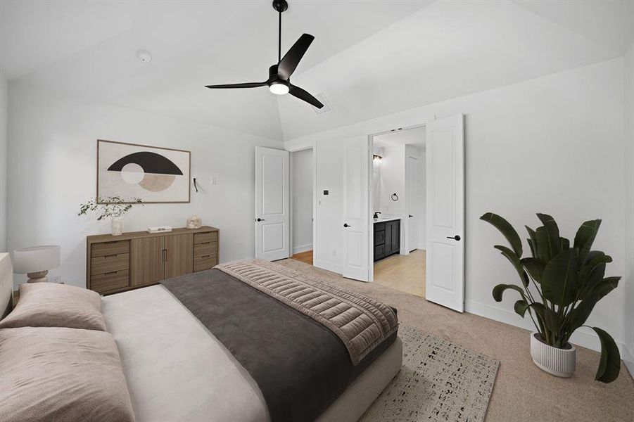 Bedroom with light colored carpet, lofted ceiling, and ceiling fan Bedroom with light colored carpet, lofted ceiling, and ceiling fan