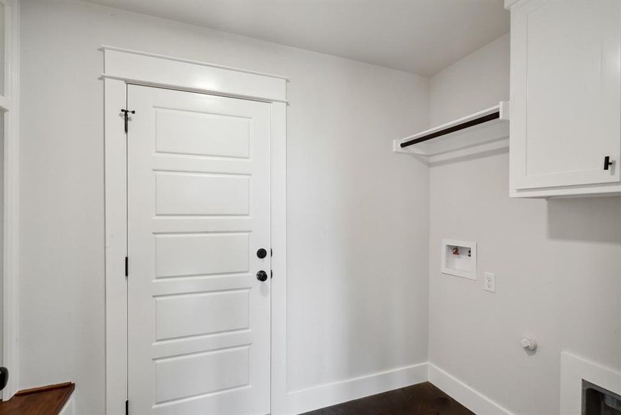 Laundry area featuring cabinets and washer hookup