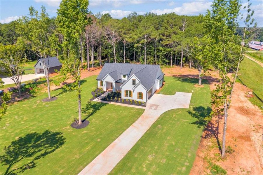 Front exterior of a new home in , Covington, GA, highlighting curb appeal (Image 1). Front exterior of a new home in , Covington, GA, highlighting curb appeal (Image 1).