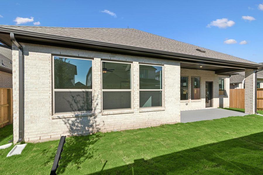 Exterior details and patio area of a home in Meridiana 55' Homesites, Manvel (Image 3).