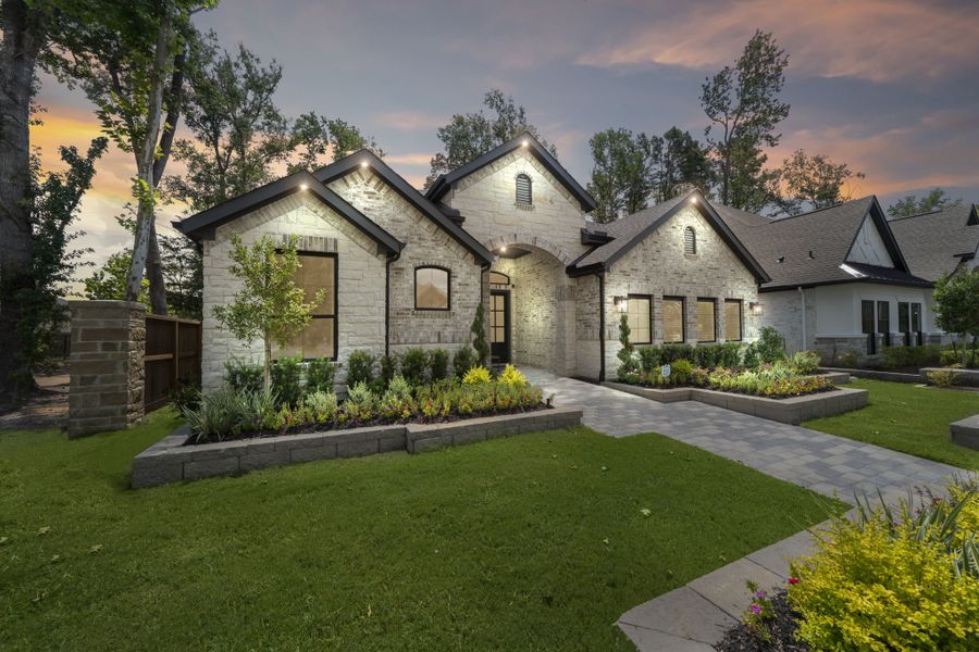 Front exterior of a new home in The Highlands, Porter, TX, highlighting curb appeal (Image 18).