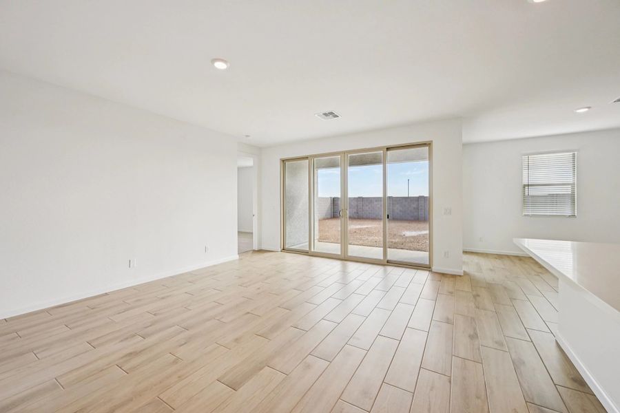 Great room with 4 panel slider to covered patio